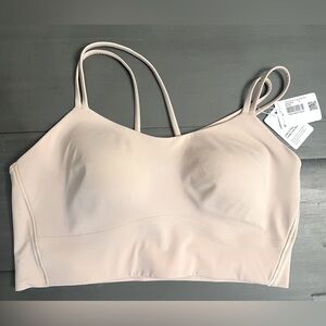 Lululemon like a cloud longline bra (size 12, B/C cup) in light pink. NWT.